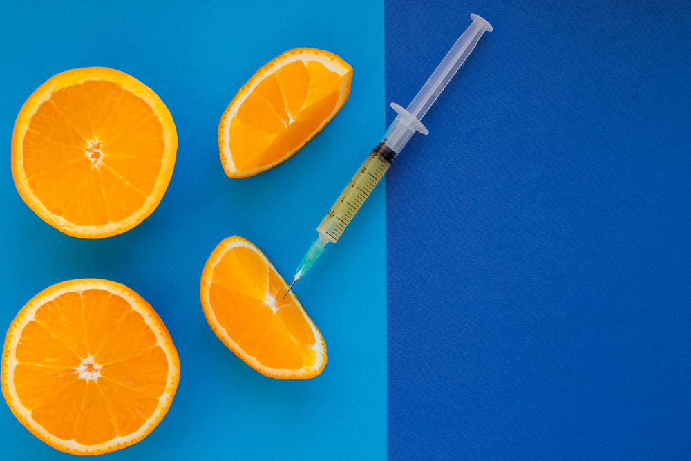 Syringe,Is,Ready,For,Mesotherapy,Injection.,Orange,In,A,Cut